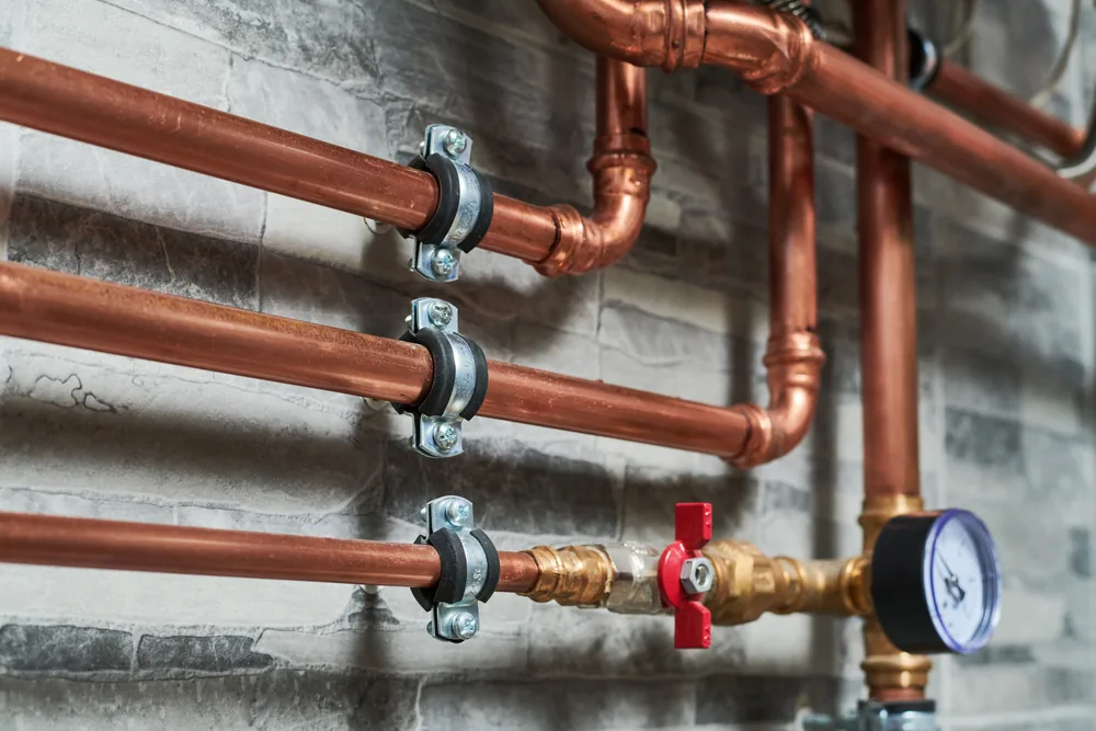 Copper pipework with valve and pressure gauge for commercial plumbing